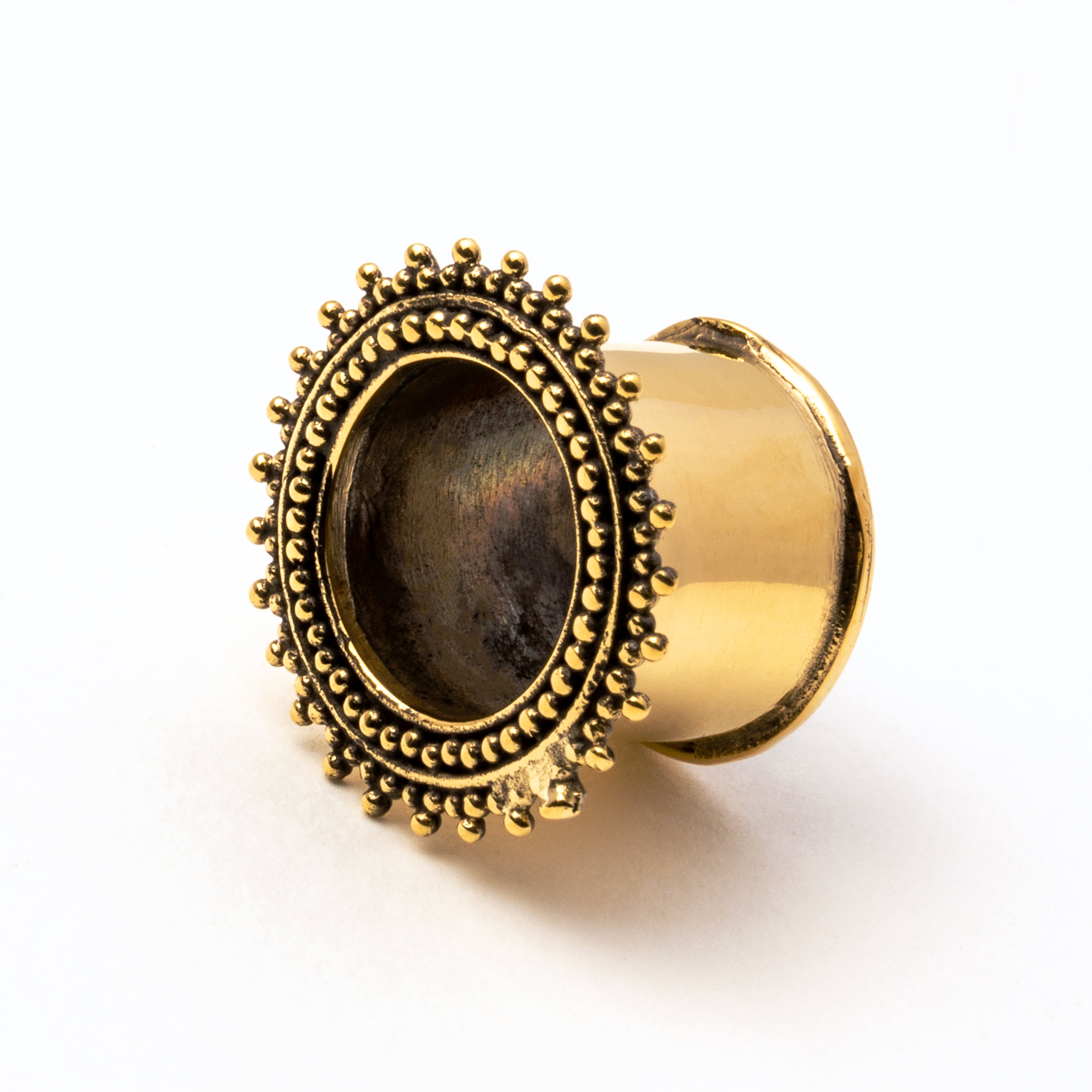 single golden brass Indian ear tunnel left front view