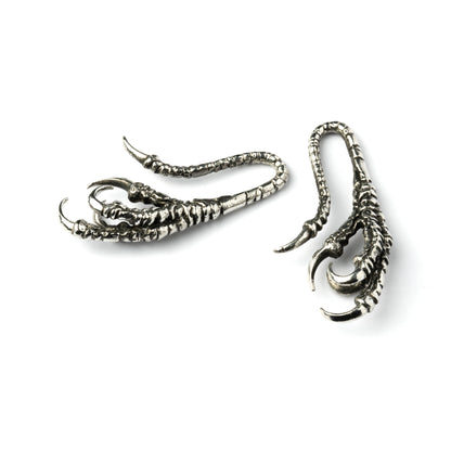 pair of silver brass dragon claw ear hangers left and frontal view