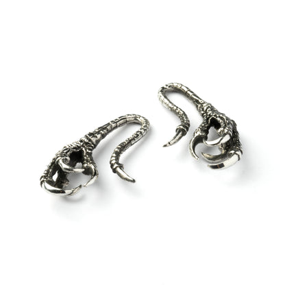 pair of silver brass dragon claw ear hangers left and down view