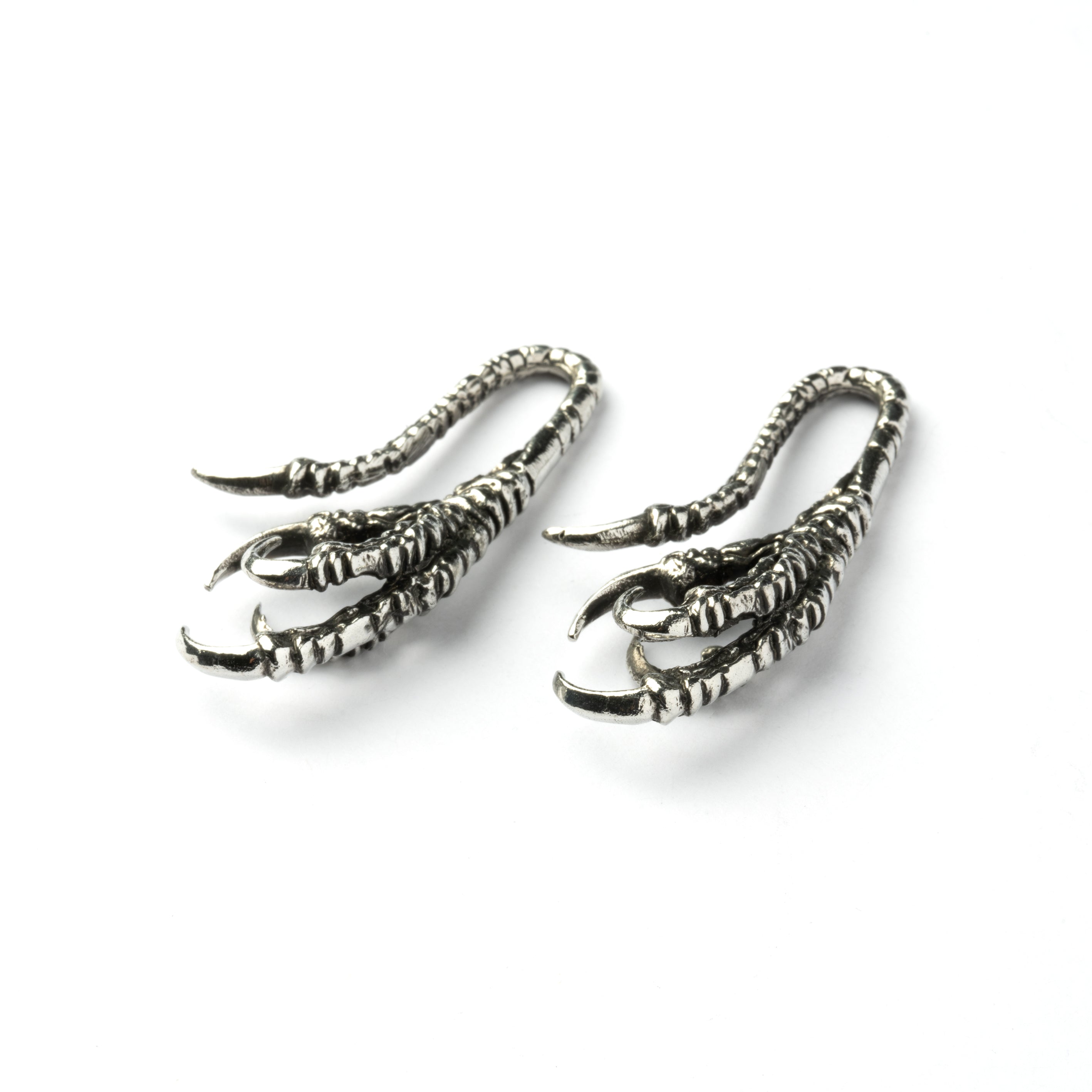 pair of silver brass dragon claw ear hangers front down view