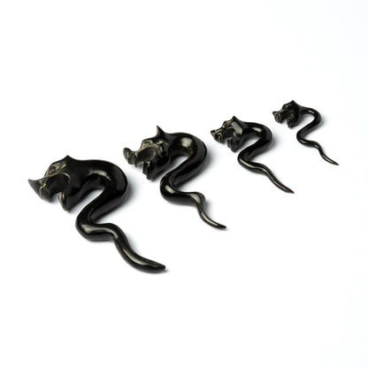 several sizes of tiger head with zigzag hook ear stretchers right side view
