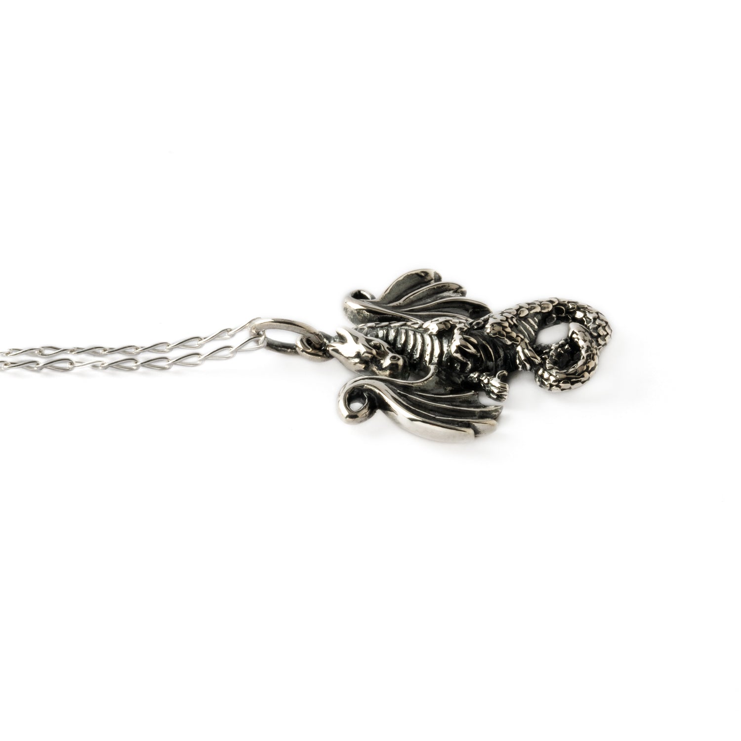 Dragon tale silver charm necklace side view