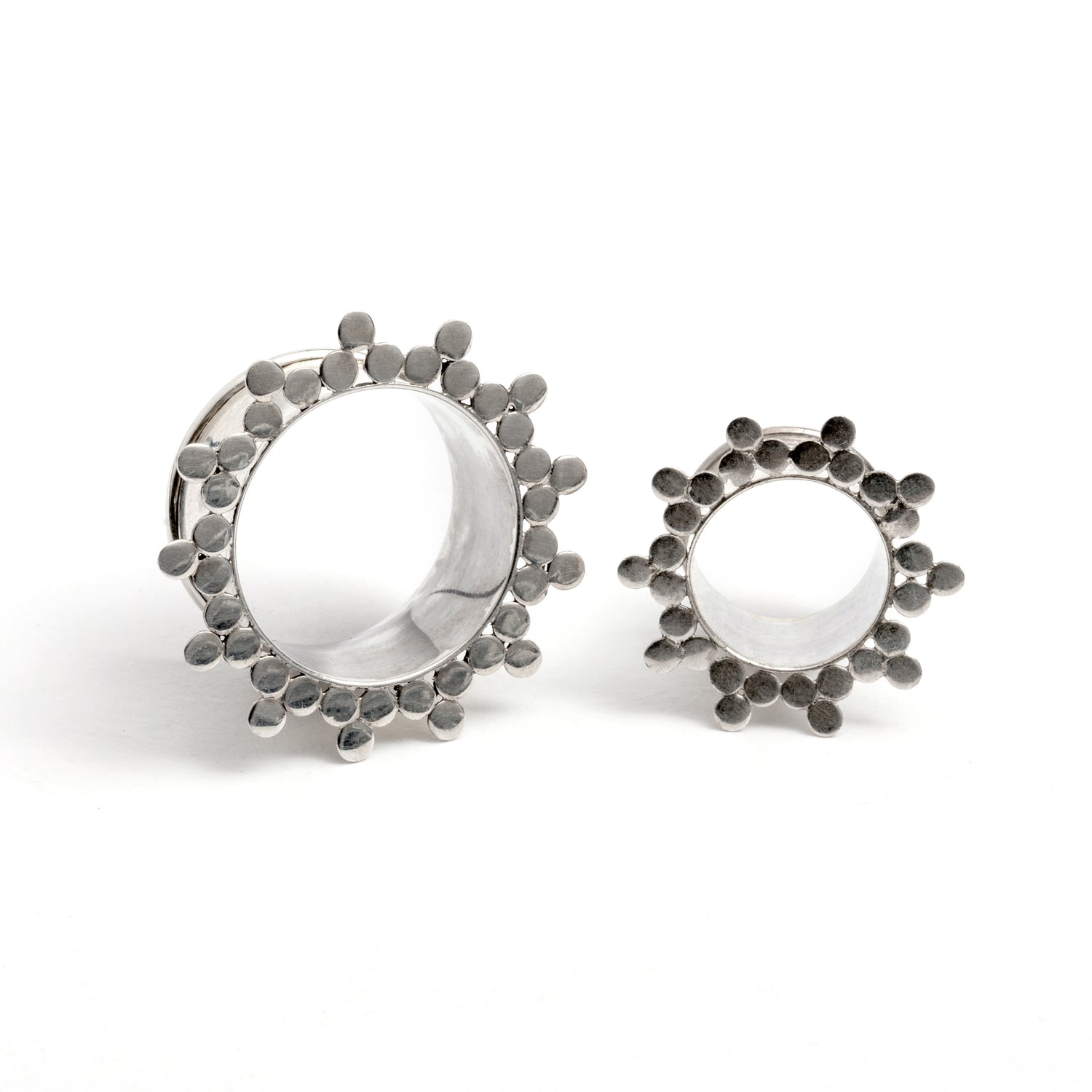 two silver spheres flower ear tunnels front view