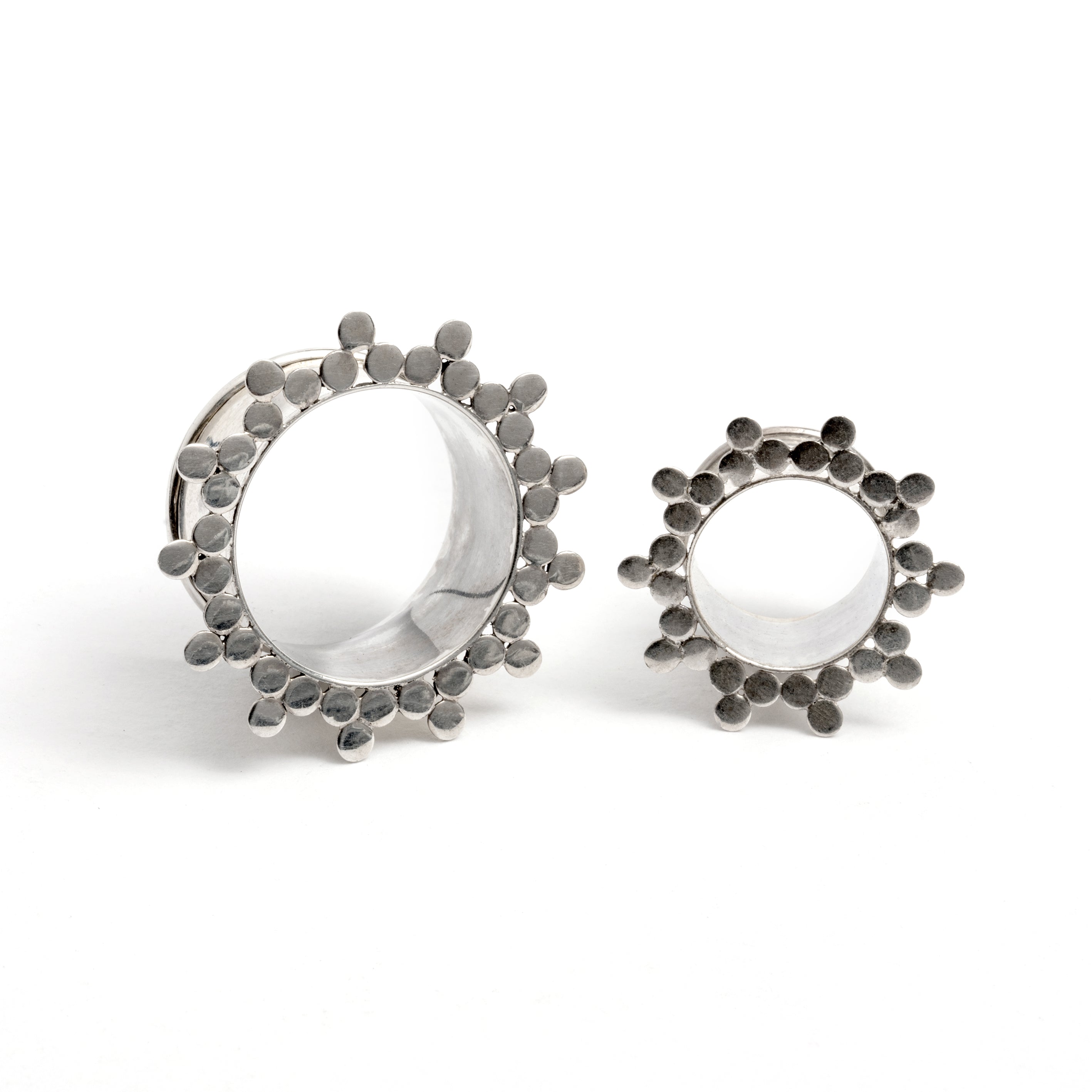 two silver spheres flower ear tunnels front view