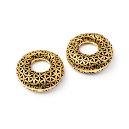pair of gold brass ear weights hoops with flower of life pattern both sides view