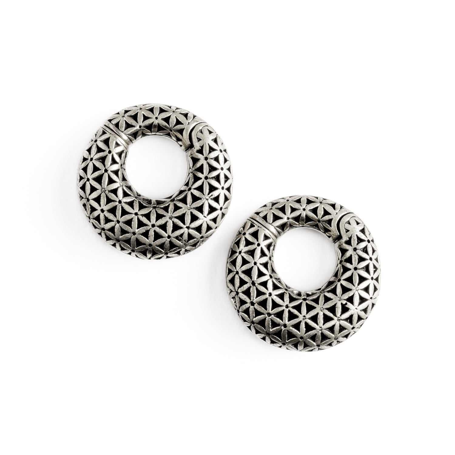 pair of silver brass ear weights hoops with flower of life pattern frontal view
