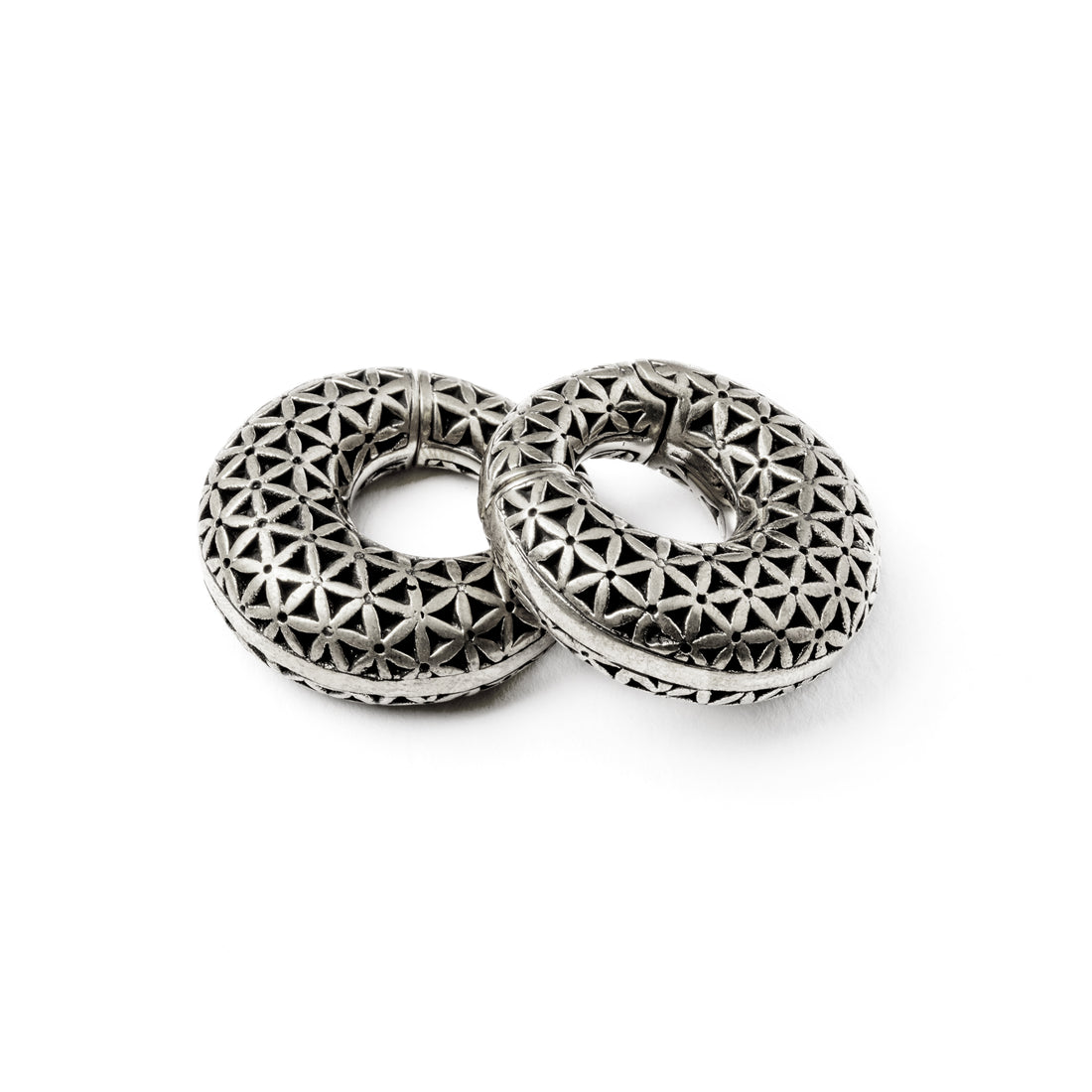 pair of silver brass ear weights hoops with flower of life pattern front and side view