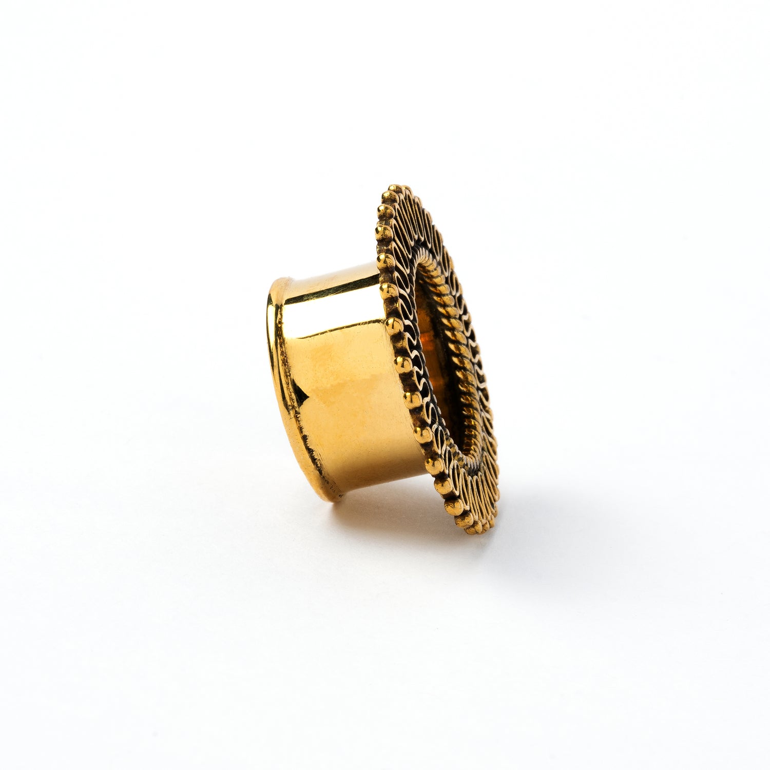 single golden brass filigree ear tunnel right side view