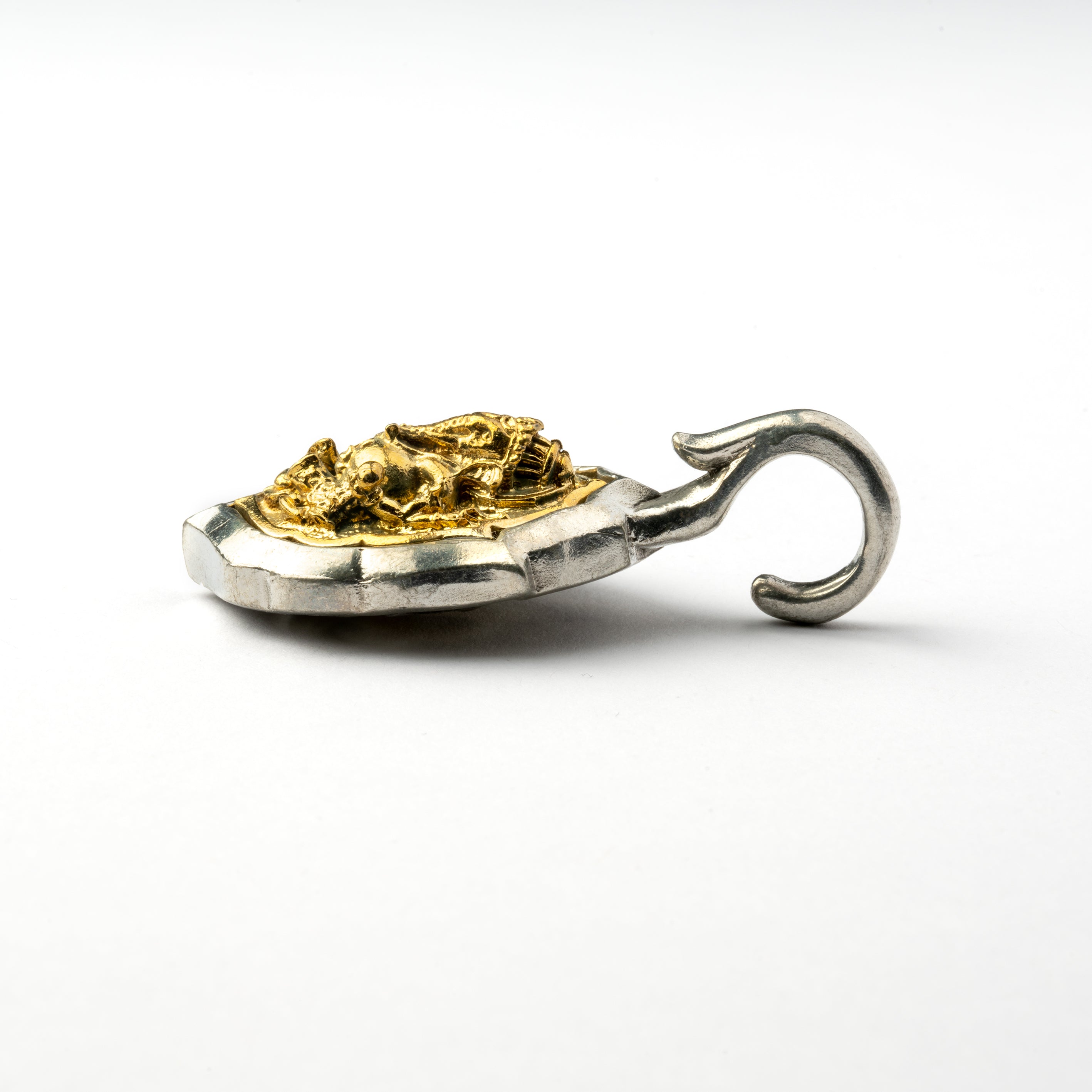 single silver and gold Ganesh & Om ear weight hangers side view