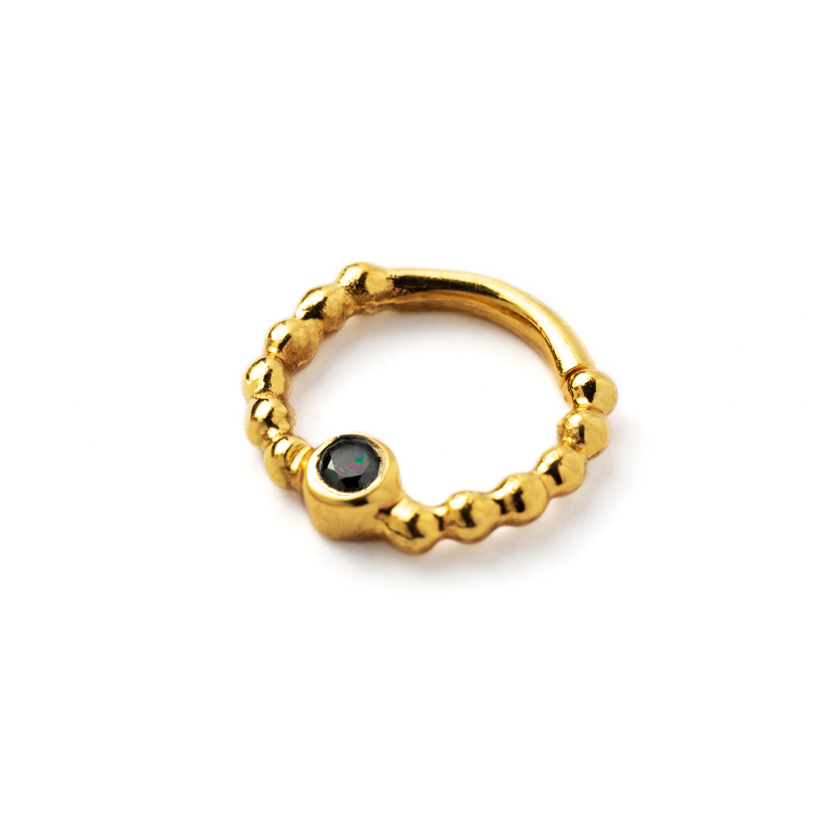 gold dotted septum ring with Black Spinal gemstone left side view
