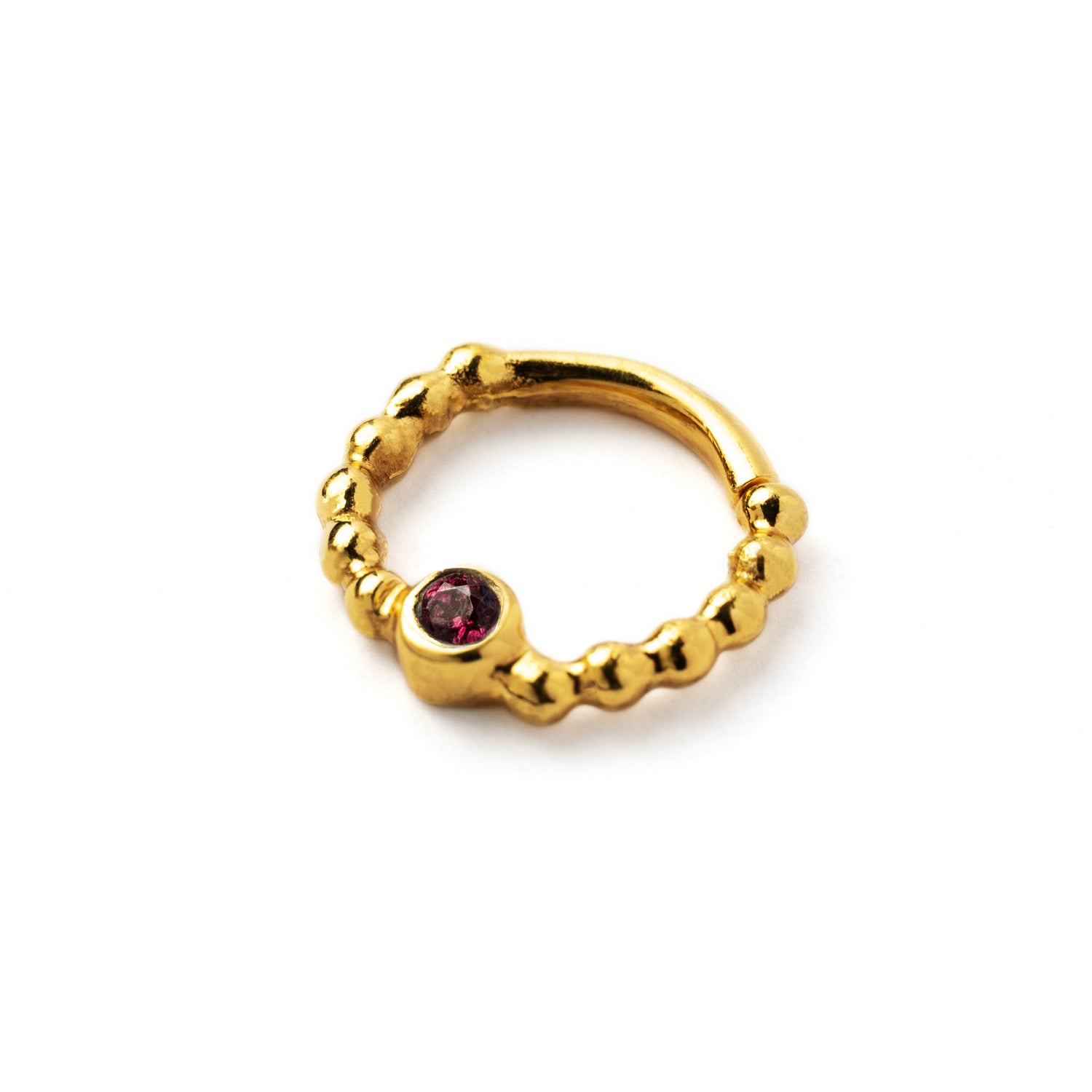 gold dotted septum ring with Garnet gemstone left side view