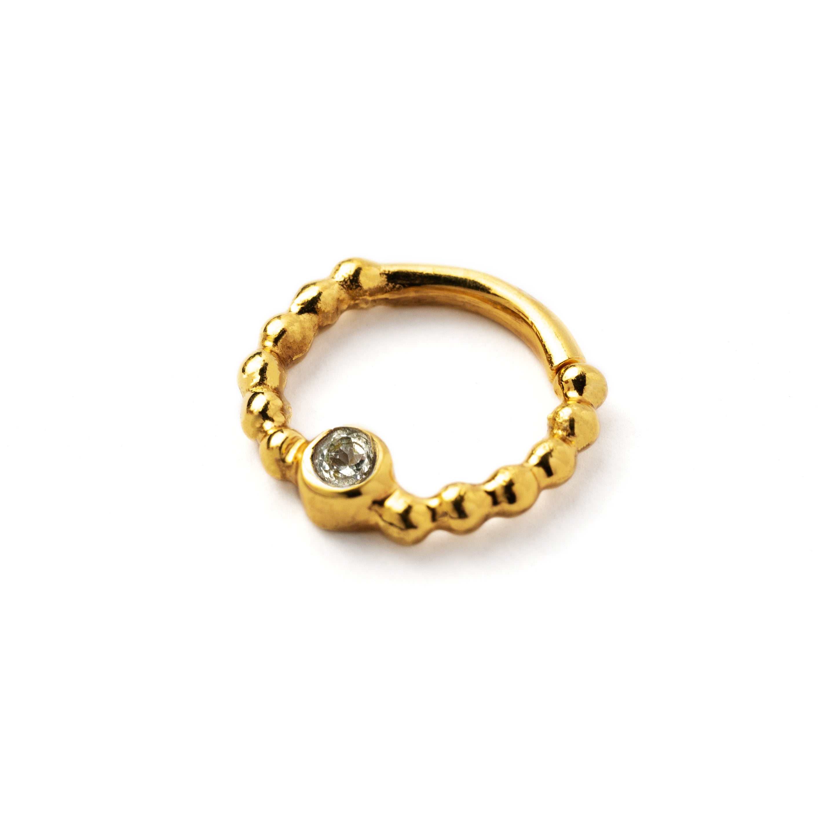 gold dotted septum ring with White Topaz gemstone left side view