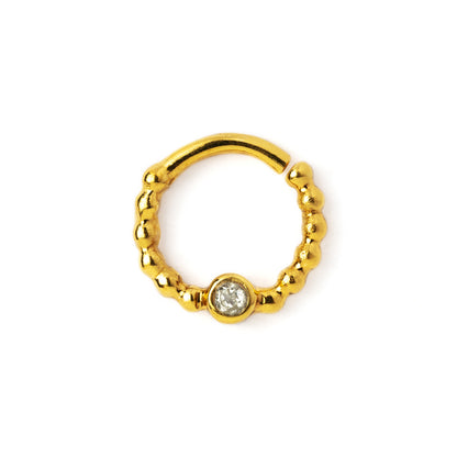 gold dotted septum ring with White Topaz gemstone frontal view