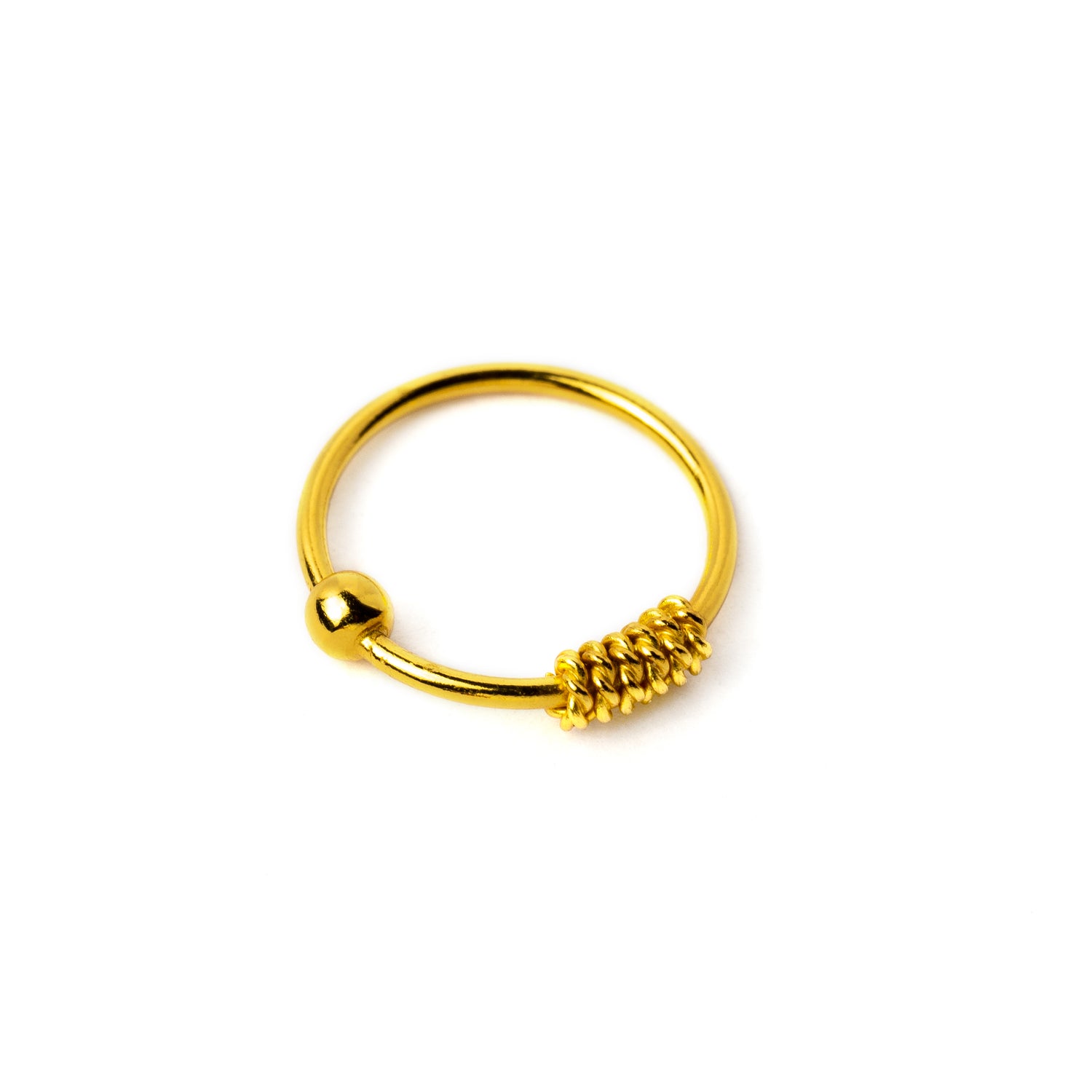 Gold coiled nose ring left side view