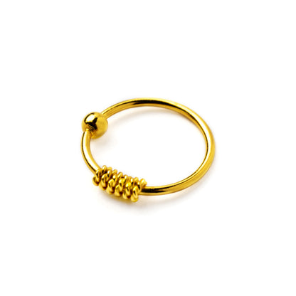 Gold coiled nose ring right side view