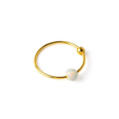 18k Gold nose ring with white Opal bead left side view