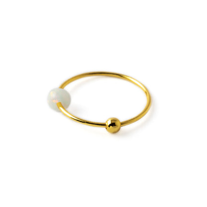 18k Gold nose ring with white Opal bead side view