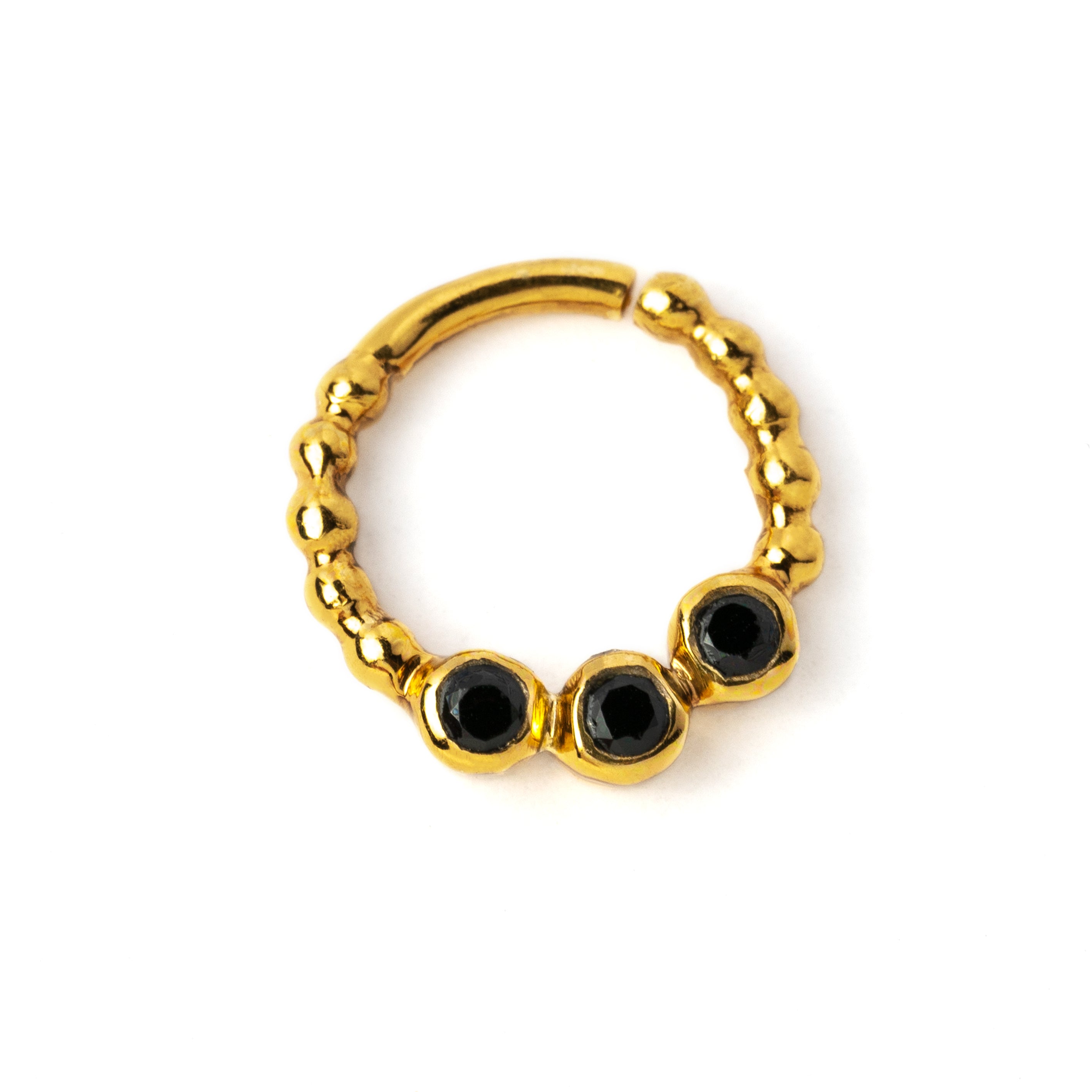 gold dotted septum ring with three Black Spinal gemstones left side view