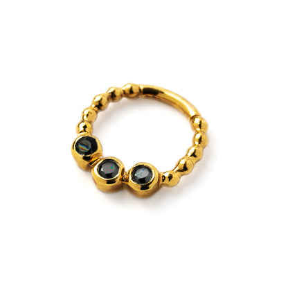 gold dotted septum ring with three Black Spinal gemstones right side view