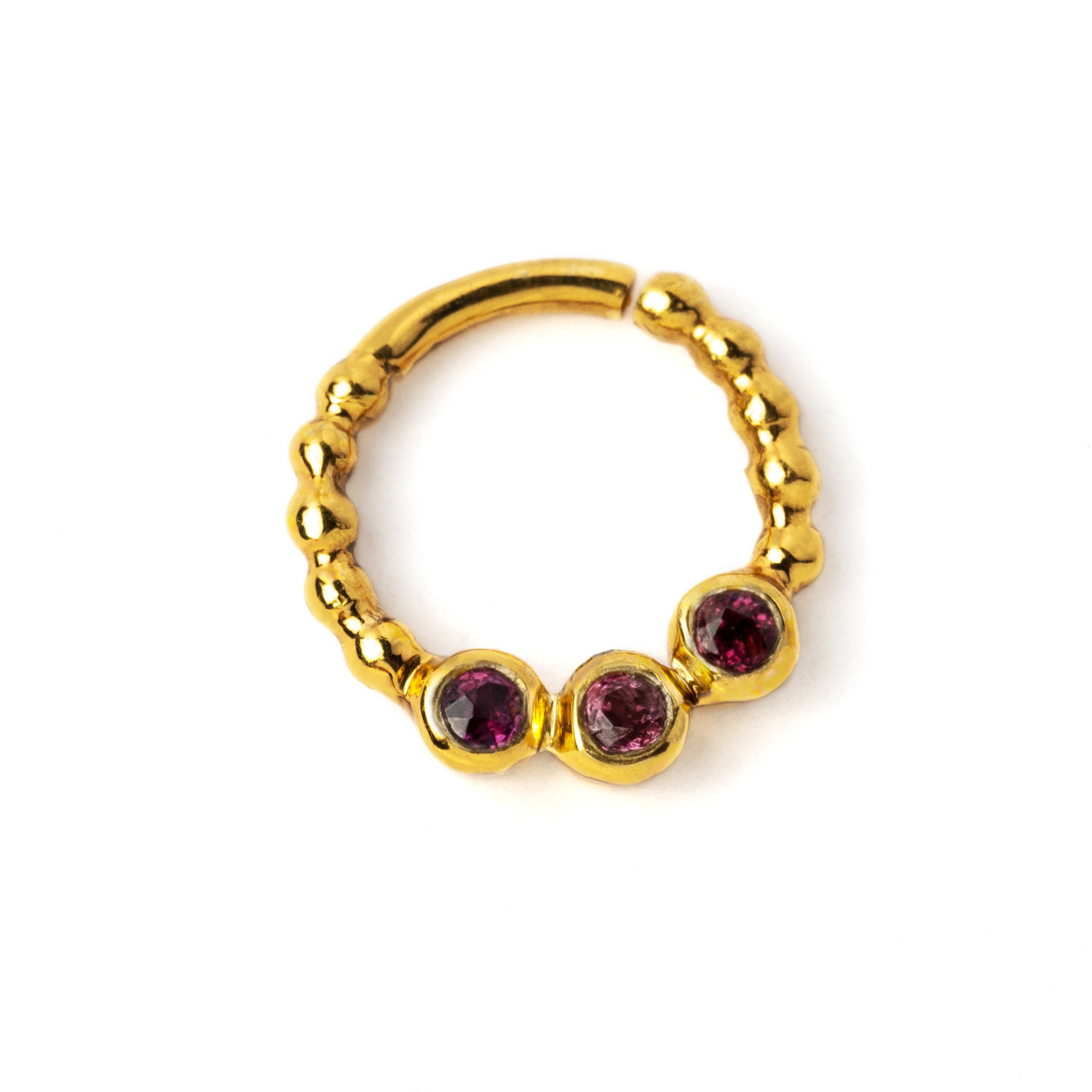 gold dotted septum ring with three Garnet gemstones right side view