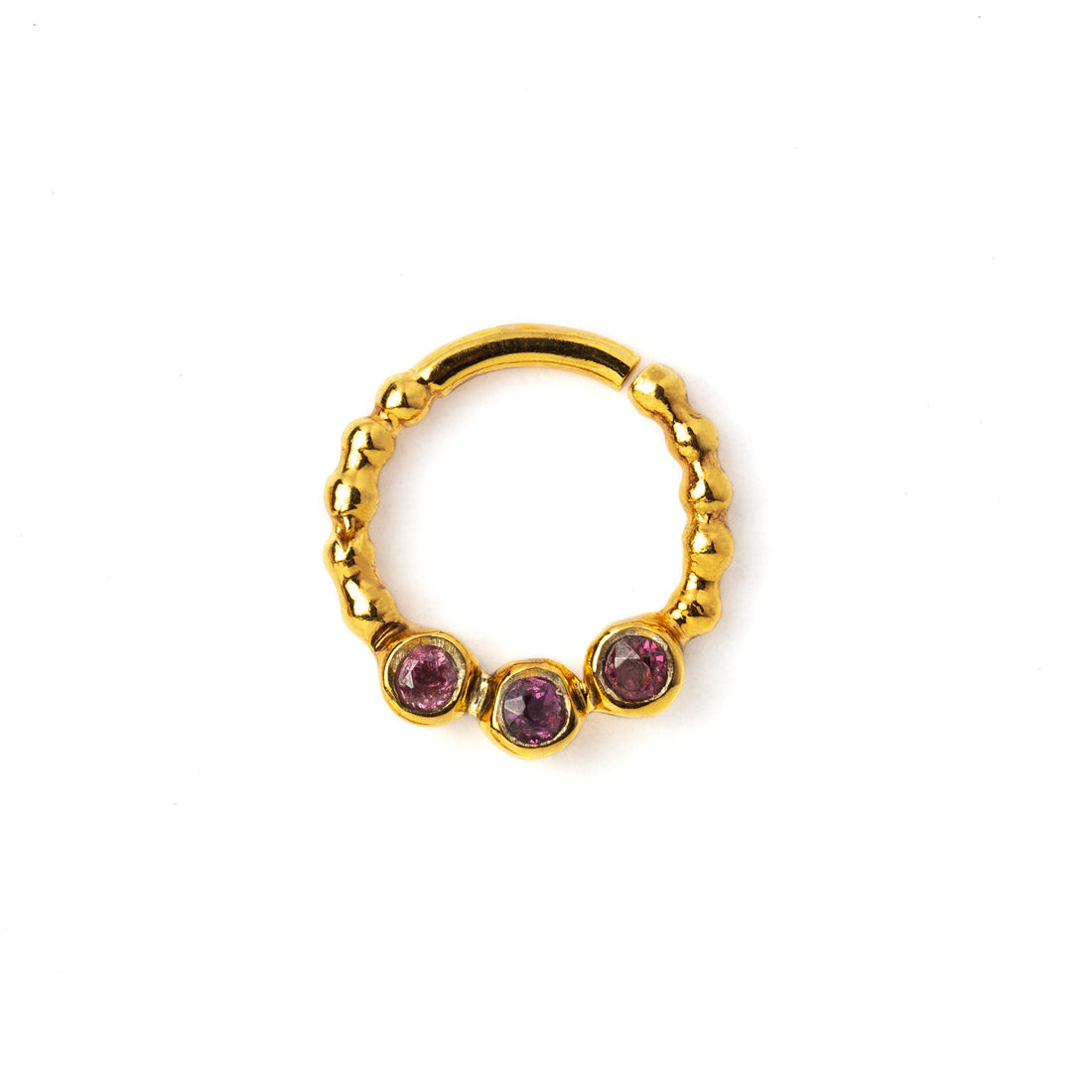 gold dotted septum ring with three Garnet gemstones frontal view