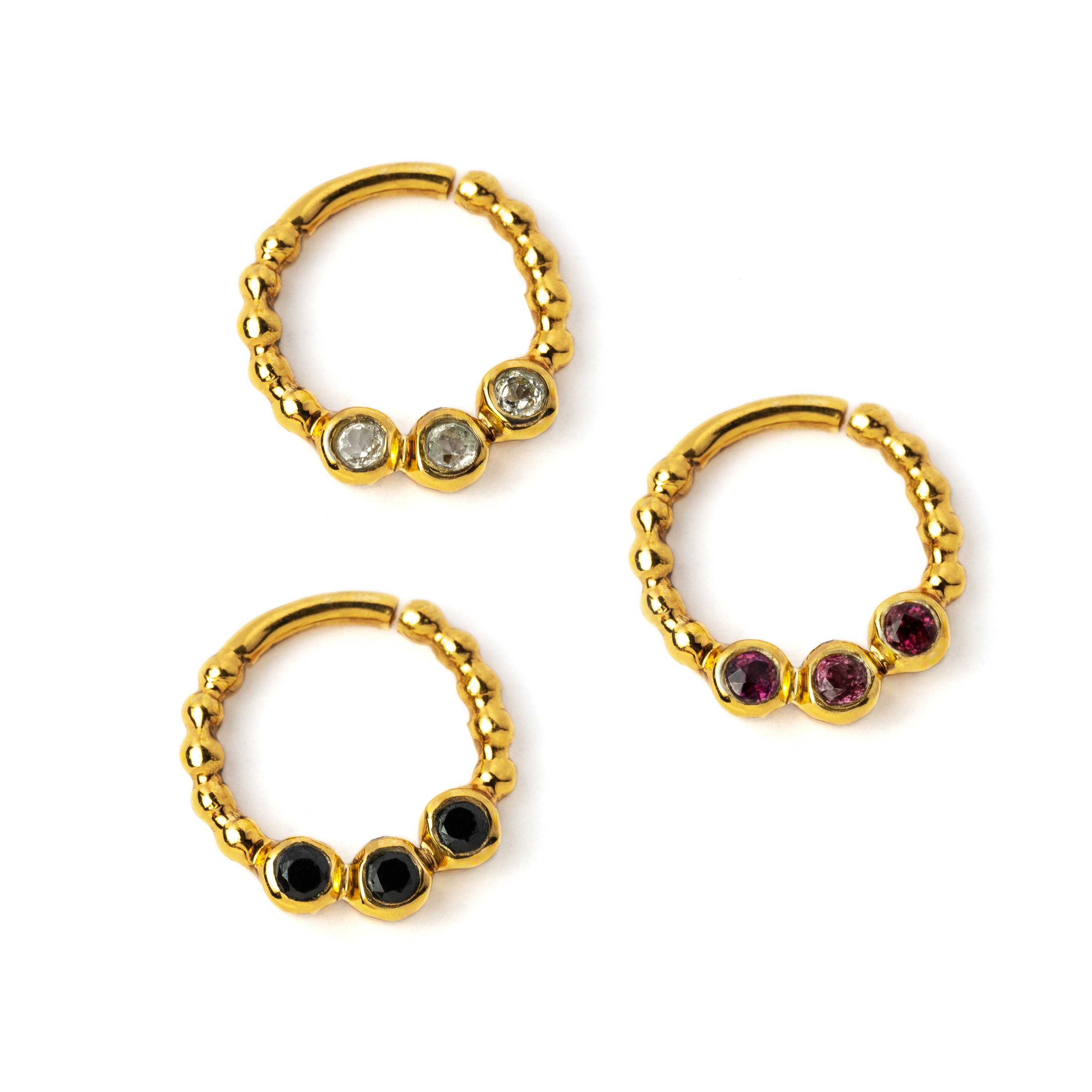 gold dotted septum ring with three Black Spinal, Ruby & Topaz gemstones right side view