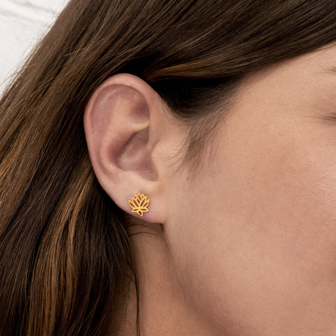 model wearing Gold Lotus contour stud earrings 