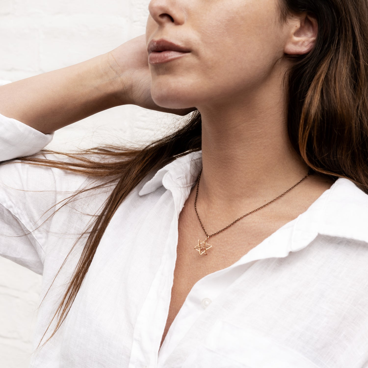 model wearing Bronze Wire Merkaba charm pendant necklace