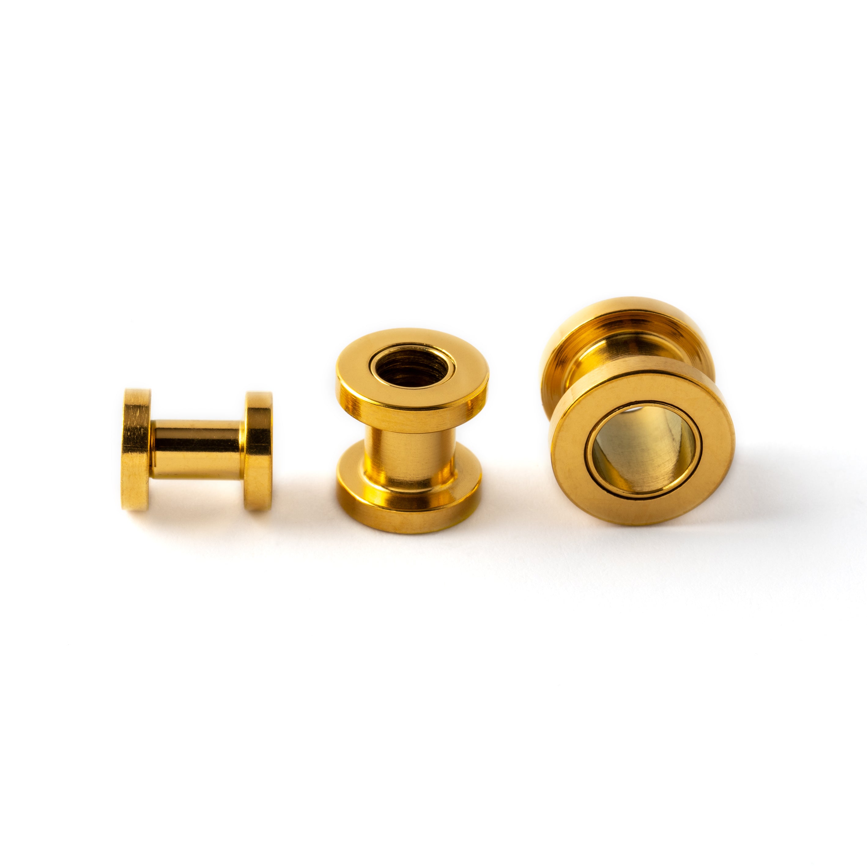 several sizes of golden surgical steel ear tunnels side and front view