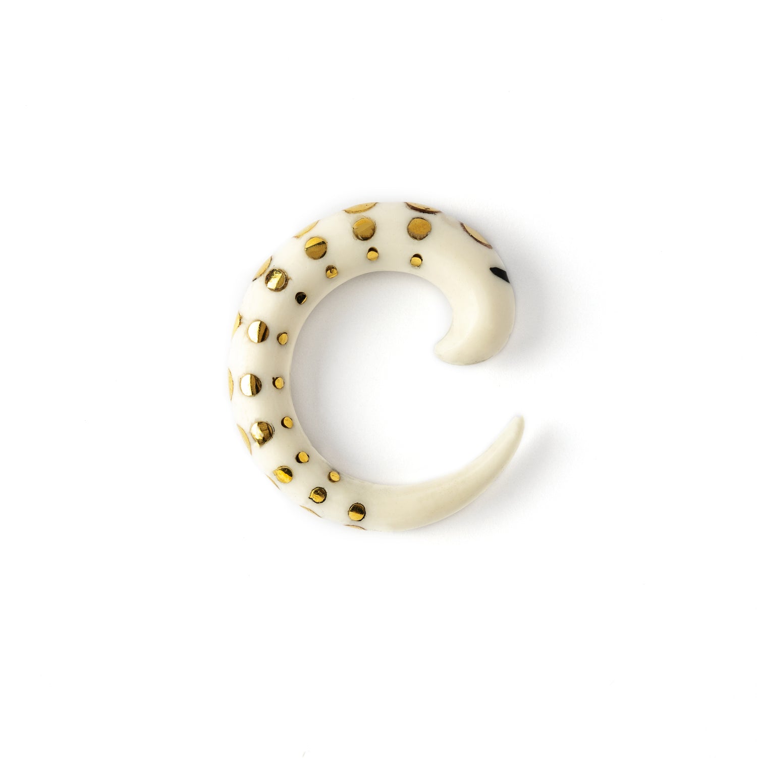 white bone taper ear stretcher with golden dots side view
