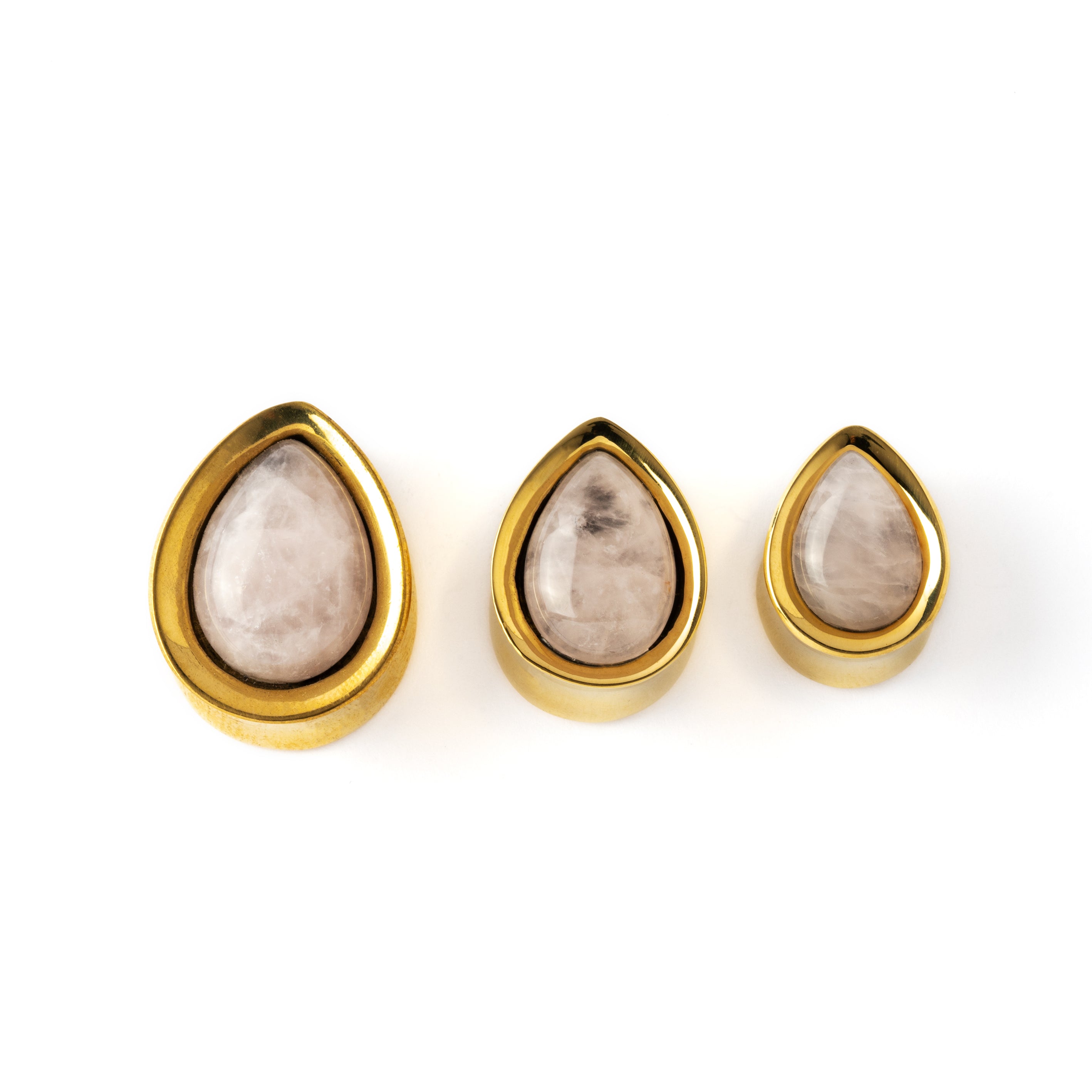 several sizes of Golden brass teardrop rose quartz ear plugs front view