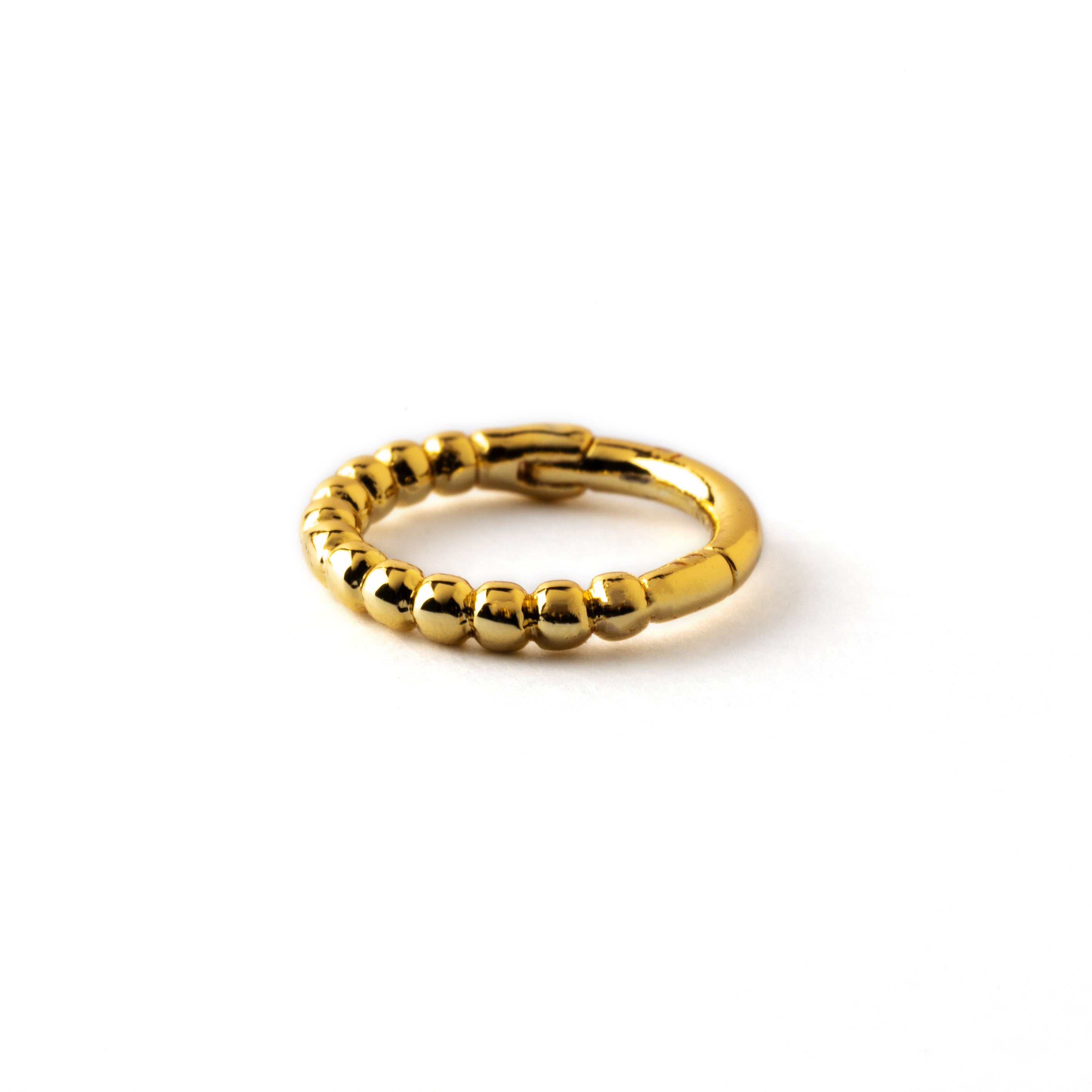 Golden surgical steel dotted piercing clicker ring down view