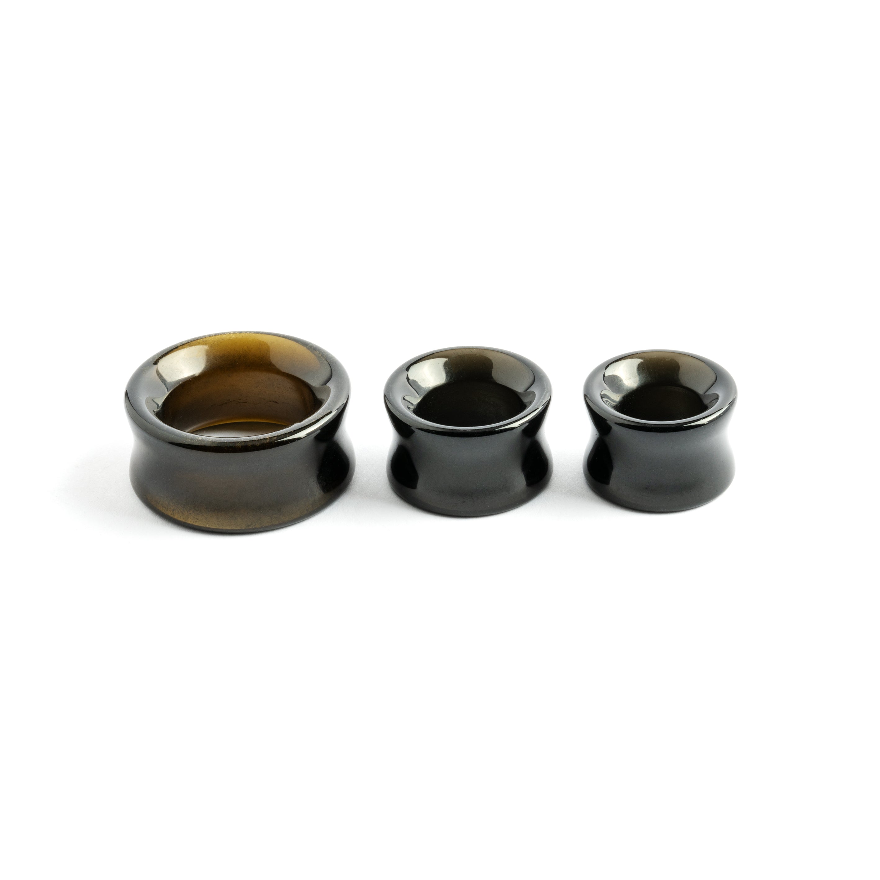 several sizes of Golden Obsidian stone ear tunnels side view
