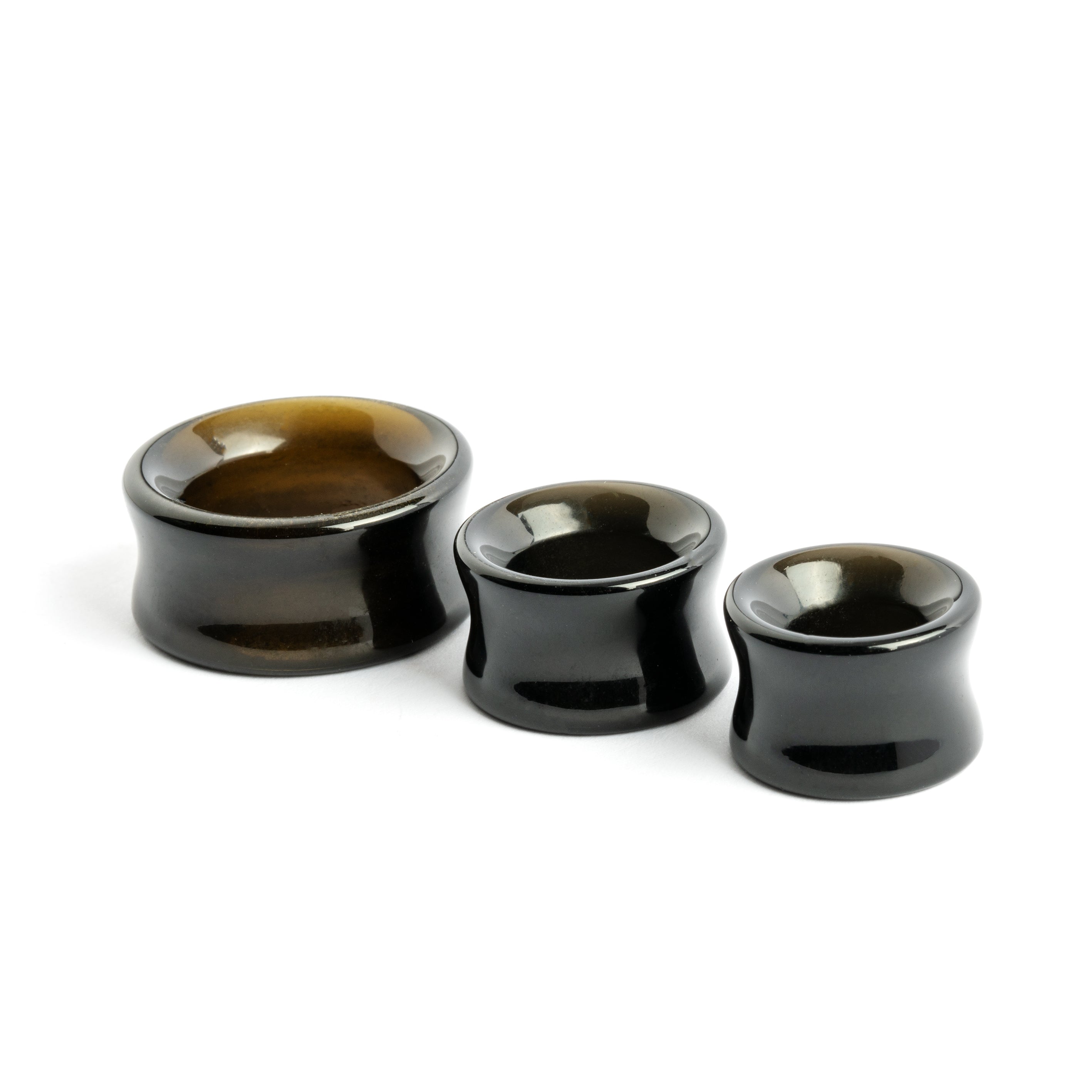 several sizes of Golden Obsidian stone ear tunnels 