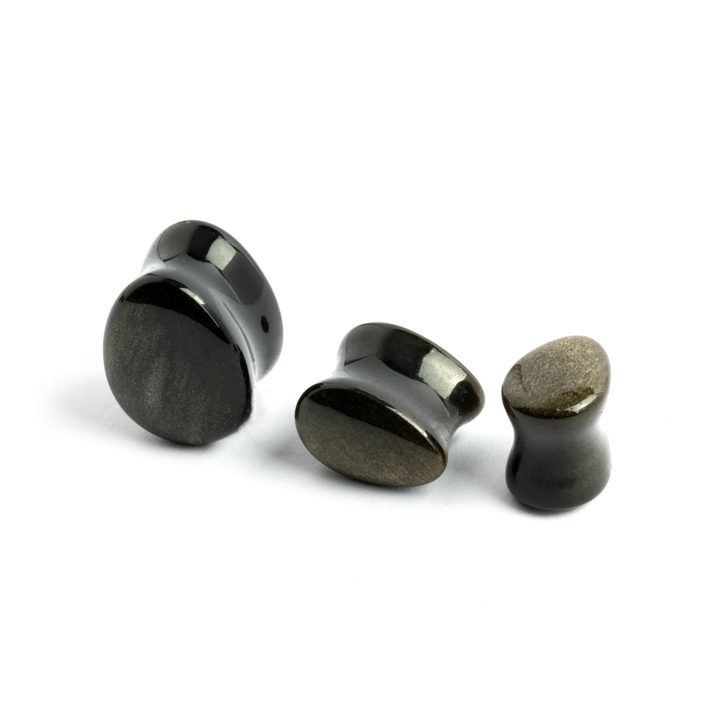 several sizes of Golden Obsidian teardrop plugs