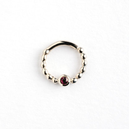 sterling silver dotted septum ring with Garnet gemstone frontal view