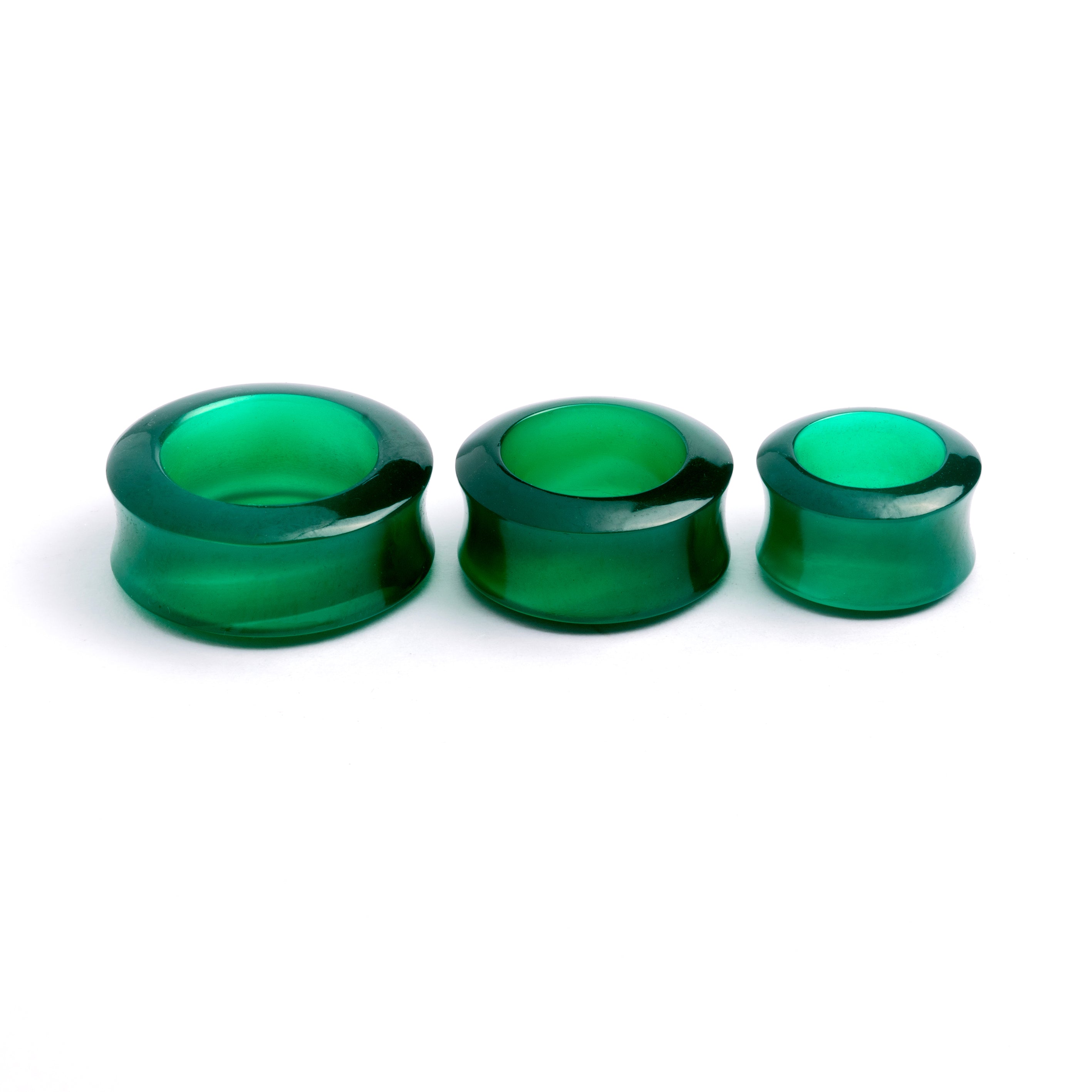several sizes of green onyx double flare stone ear tunnels side view