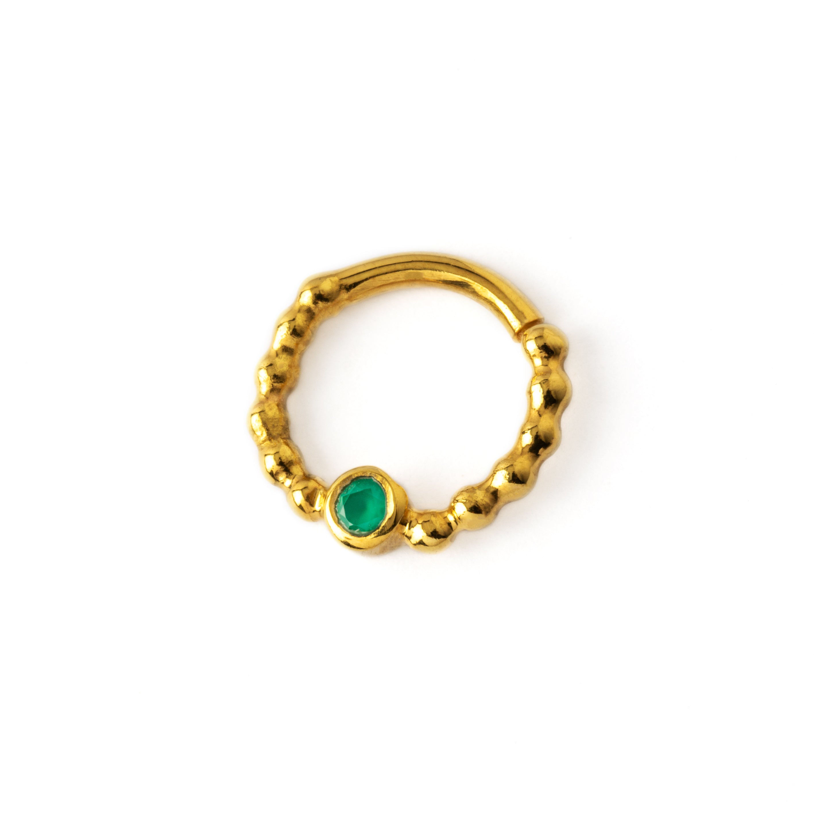gold dotted septum ring with Emerald gemstone left side view