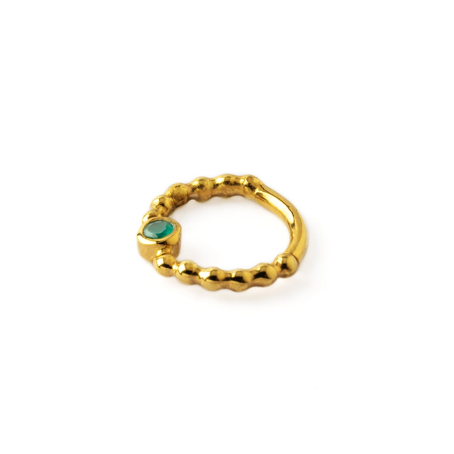 gold dotted septum ring with Emerald gemstone side view
