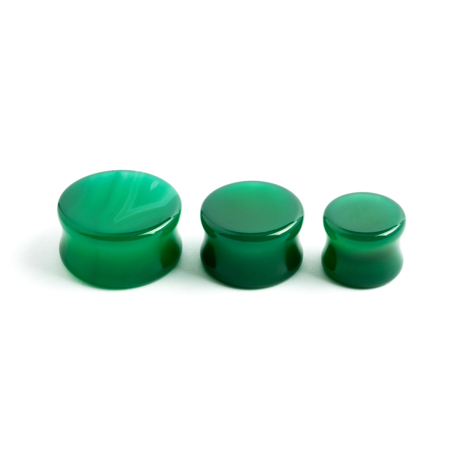 several sizes of green onyx double flare stone ear plugs right side view
