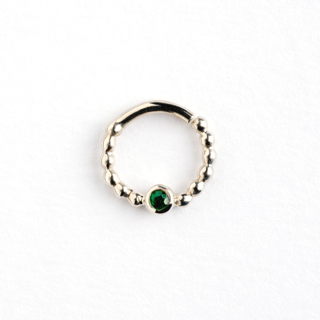 sterling silver dotted septum ring with Emerald gemstone frontal view