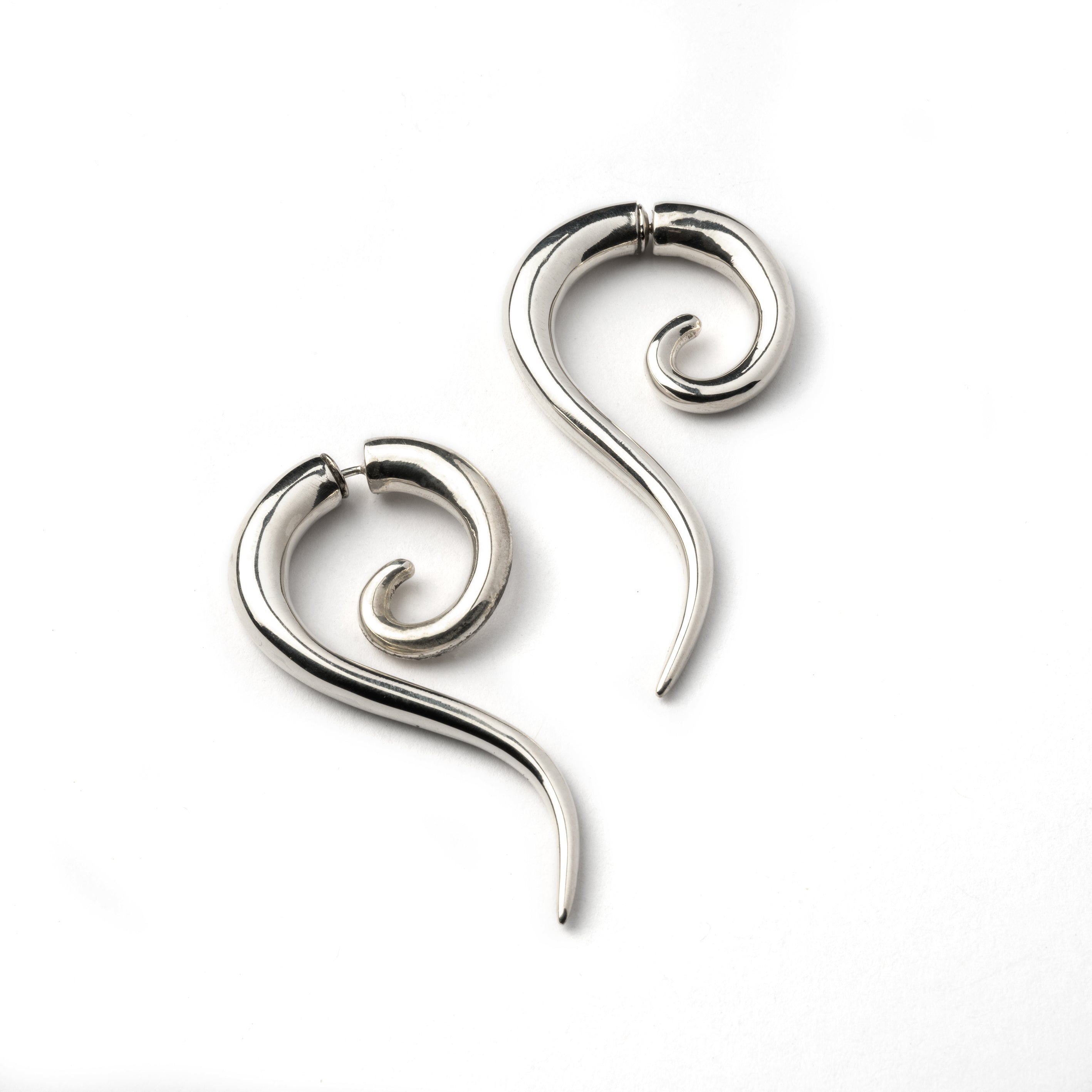 pair of Haku Silver fake gauge earrings side view