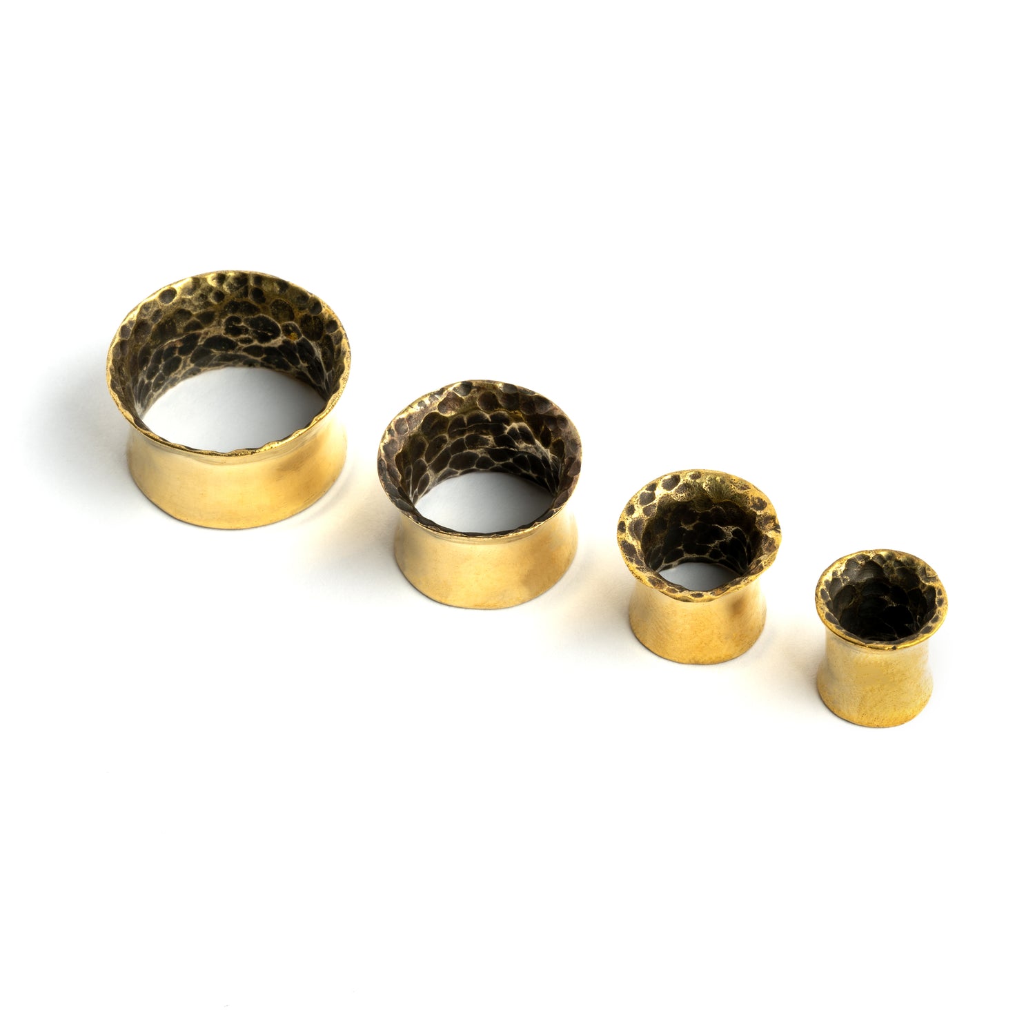 different sizes of Hammered brass ear tunnels frontal view