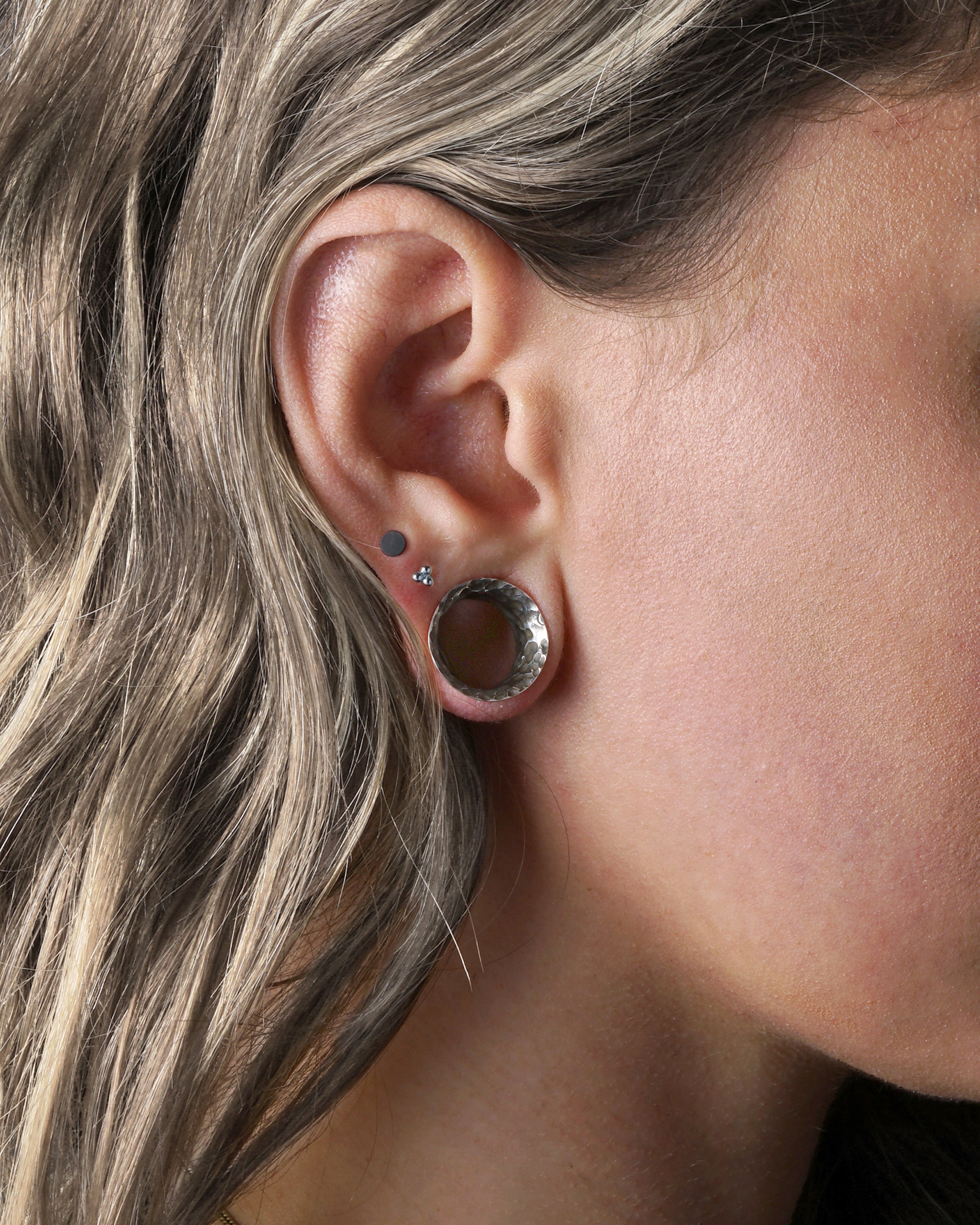 model wearing Hammered Silver Tunnels