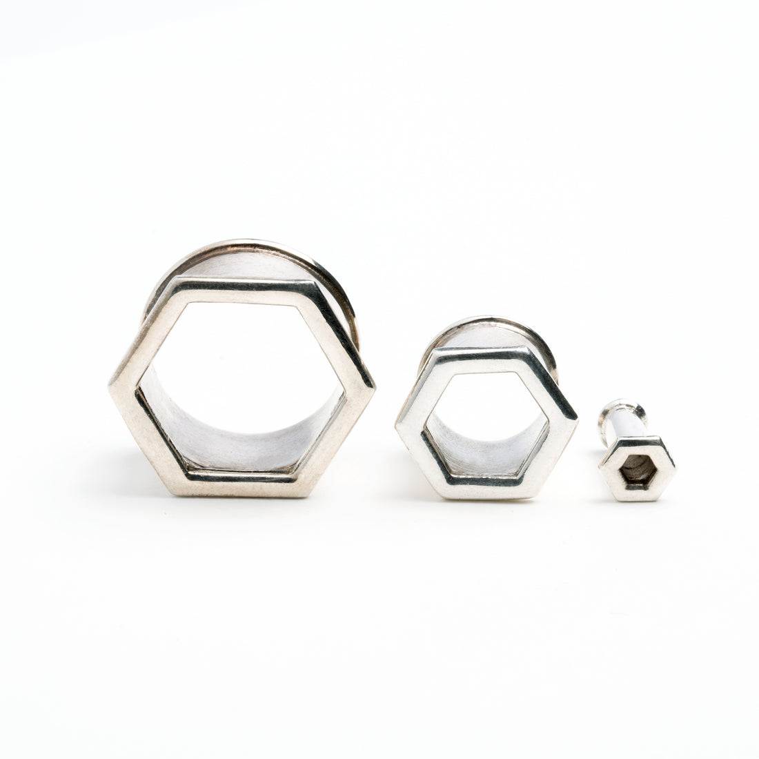 several sizes of hexagon ear tunnels front view 