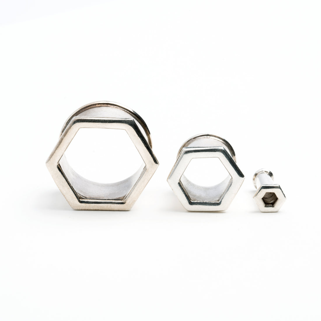 several sizes of hexagon ear tunnels front view