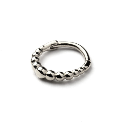 surgical steel septum clicker ring with tiny spheres macro view