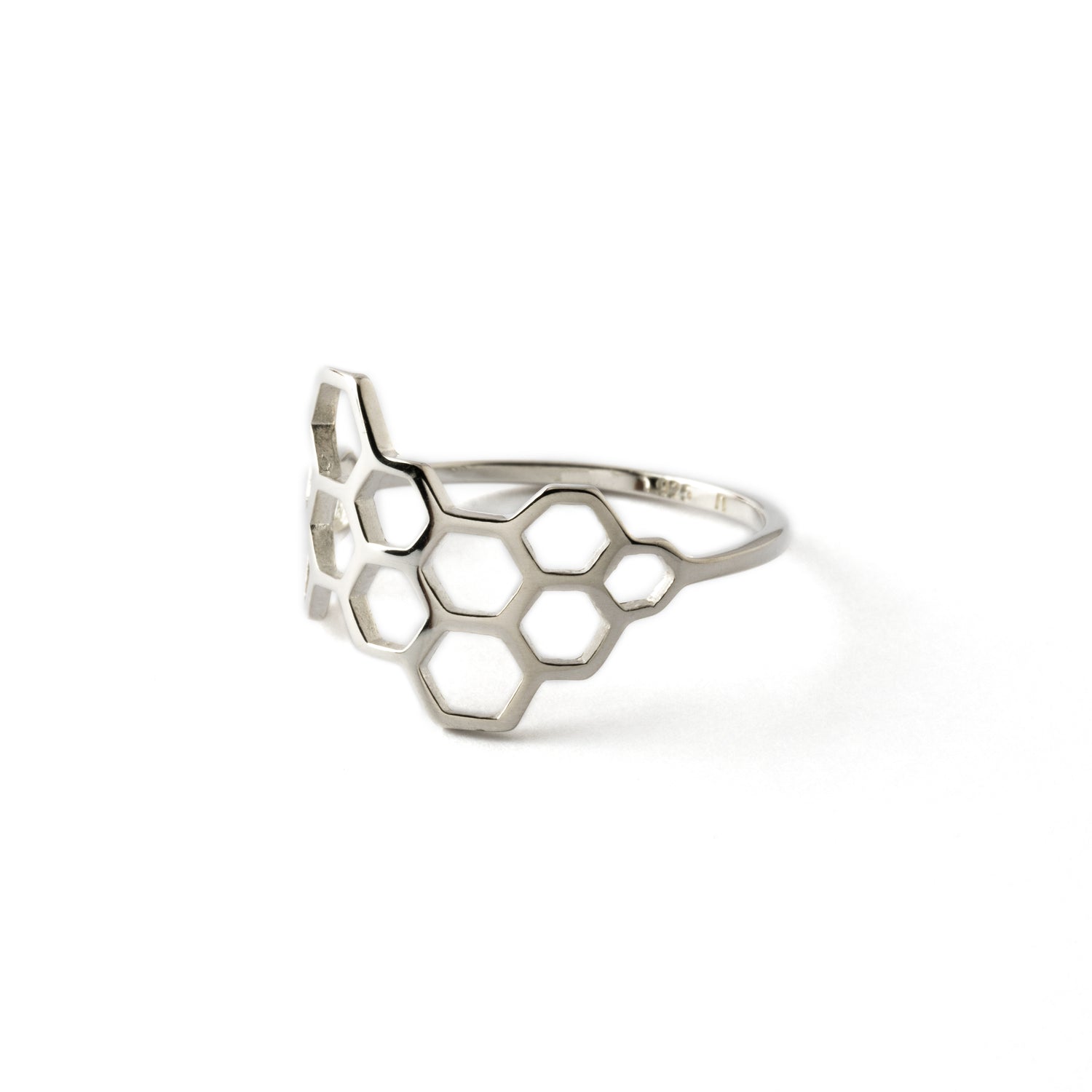 silver ring with honeycomb outlines left side view