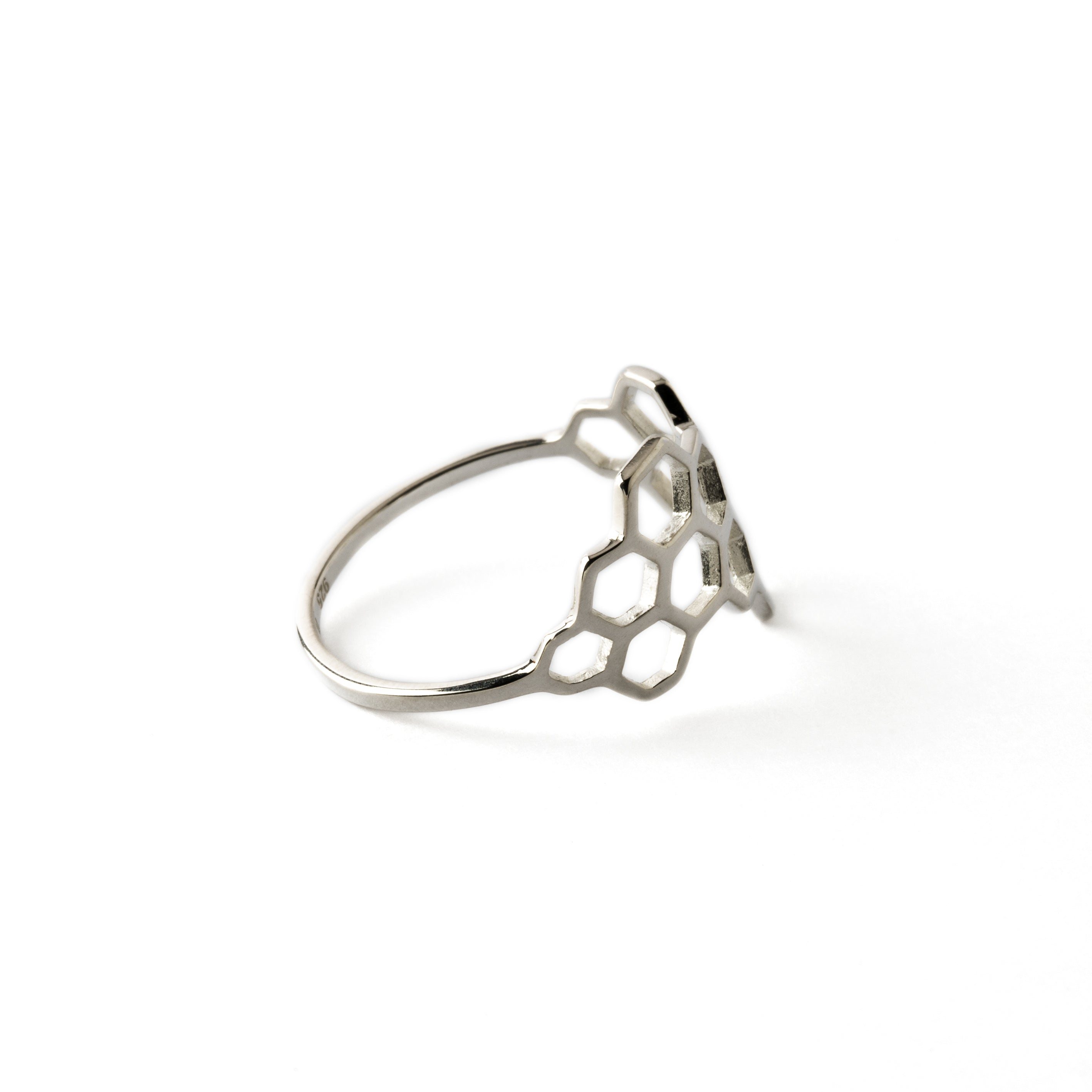 silver ring with honeycomb outlines side view
