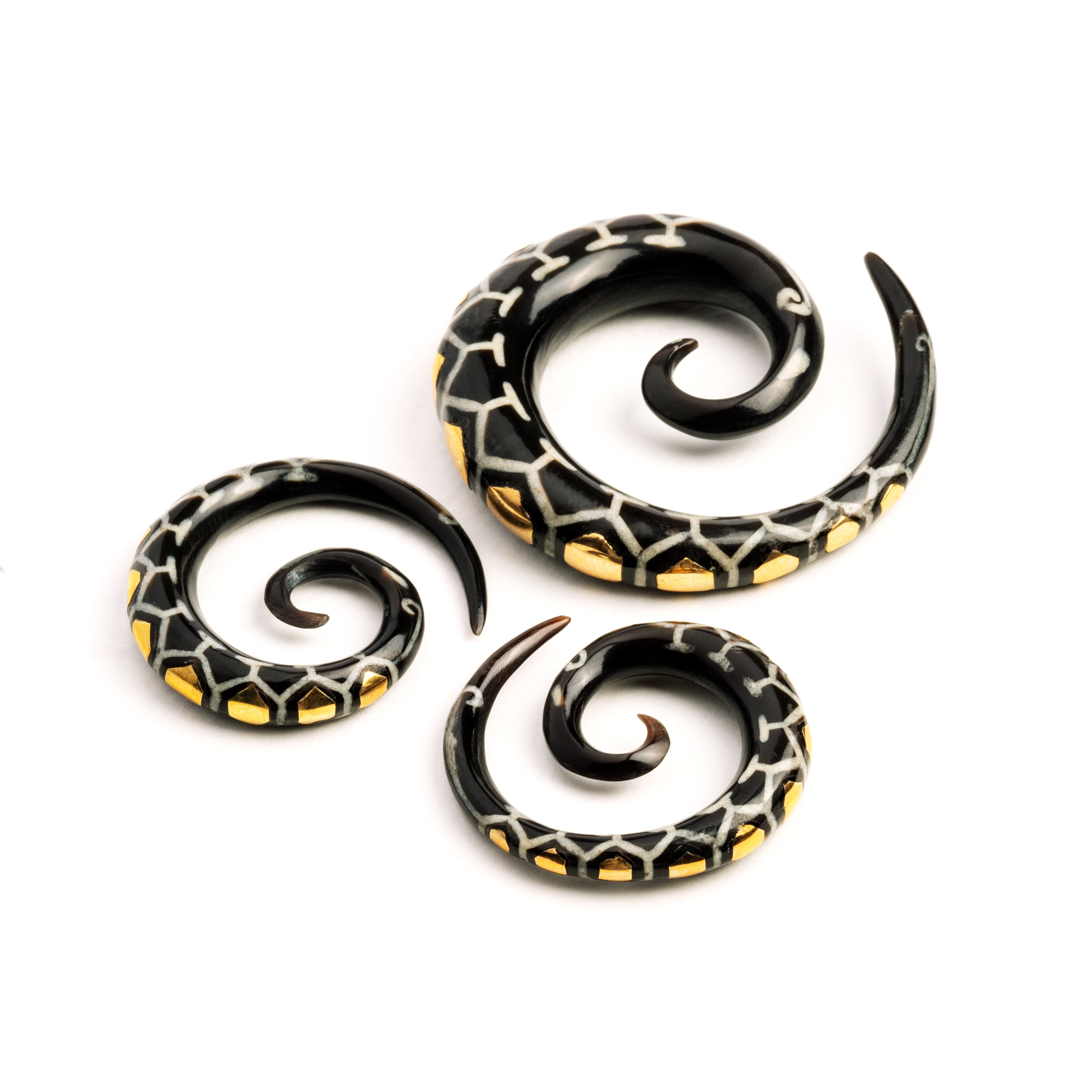 different sizes of honeycomb spiral ear gauges frontal view